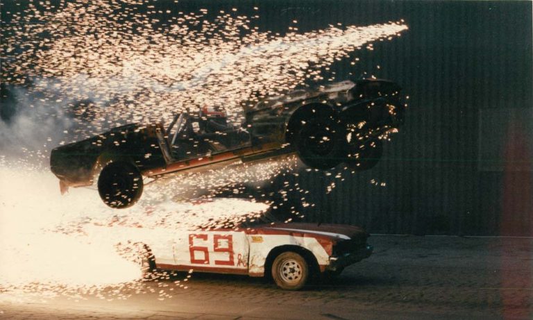 Car flying through air with sparks
